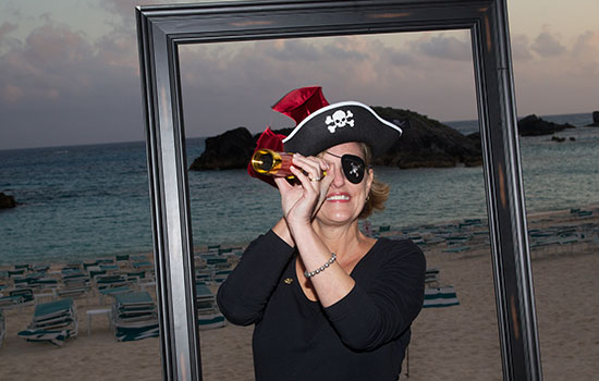 Patti peers through a scope while in Pirate costume